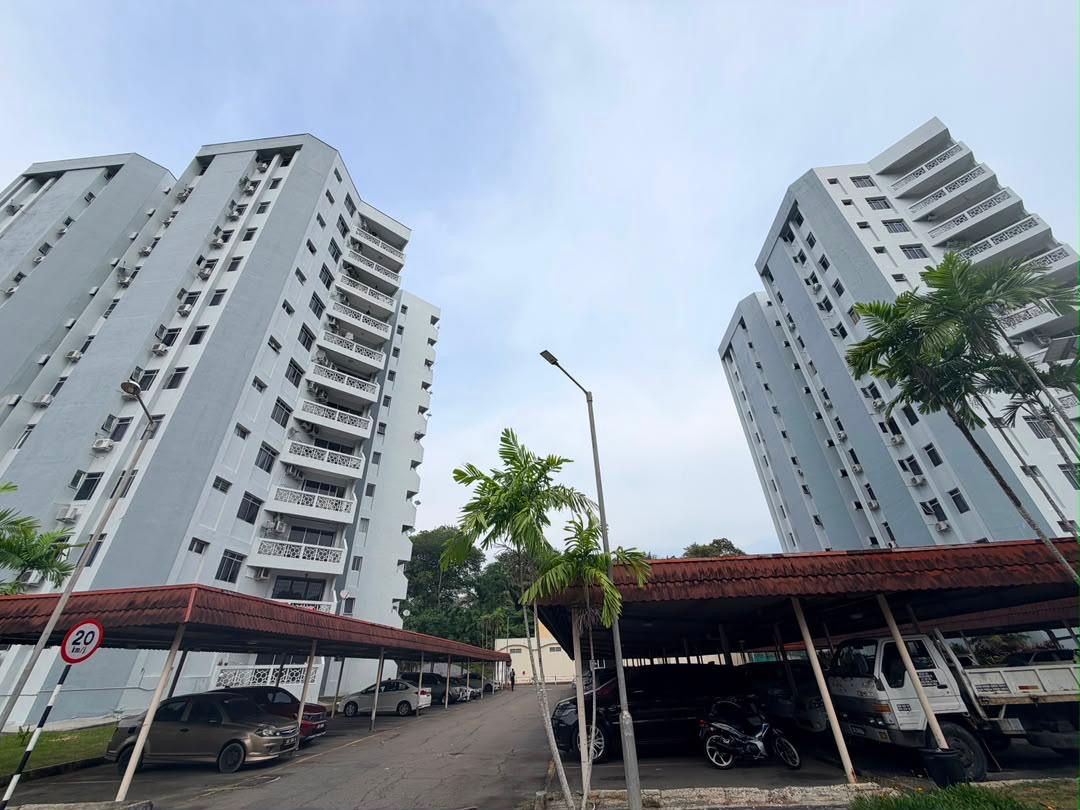 Exterior buildings and covered parking at Colonnades Condominium